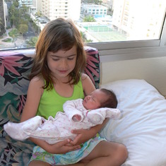 Big sister Madelyn holding little sister Christiana Mylee