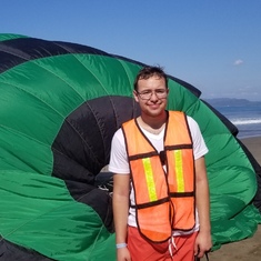 I'm enjoying Ixtapa/Zihuatanejo beach in Mexico after a thrilling paragliding trip.