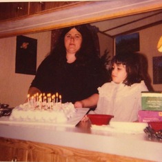 Cindy with a birthday cake for her daughter Maria