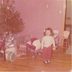 Cindy as a toddler at Christmas
