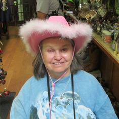 Trying on a hat in Tombstone