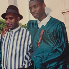 with his son Clarence at his high school graduation