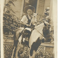 Clay on his pony with his jack russell "Spot" in Victoria.