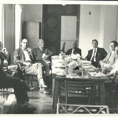 Clay in a meeting third from right. Perhaps late 1950.