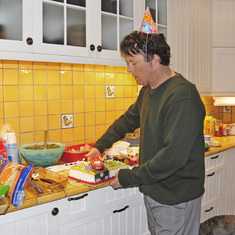 Augustin's 5th birthday party in the new corner nouse - Claude serves cake!