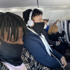 Claude and Augustin on flight to Mexico, Xmas 2021