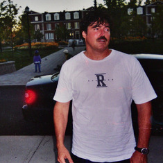 Scott outside the first house in Bois Franc, 2004