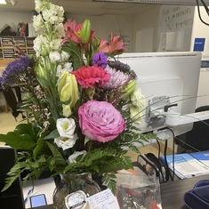 Claude's sister and Scott give flowers to the staff at the Saint Jerome Hospital on Oct. 25