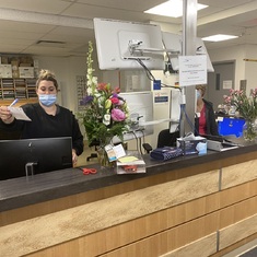 Claude's sister and Scott give flowers to the staff at the Saint Jerome Hospital on Oct. 25