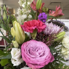 Claude's sister and Scott give flowers to the staff at the Saint Jerome Hospital on Oct. 25