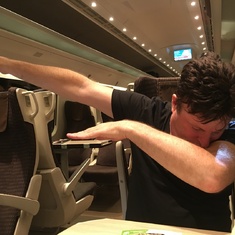 Claude doing a "dab" on a train in Italy, 2015