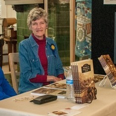 Claudia at a book signing, contributed by Larry Mickartz from an edition of GMH Today