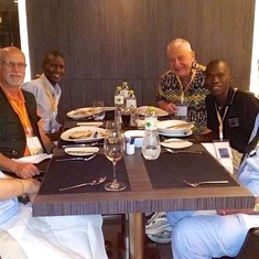 Albert Mangeni and Emmanuel Akatukunda dining with Dad