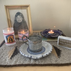 We keep a small shrine to Colleen’s memory in a tranquil resting spot in our home where some of her ashes rest.