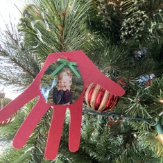 Conner’s hand trace and picture from 2021 hanging on the Christmas tree in Hillsboro.