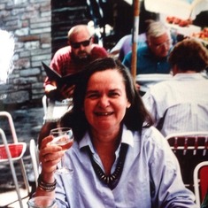 mother with glass of wine in italy