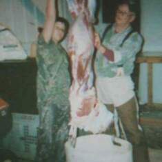 Skinning a deer with his grandfather. 