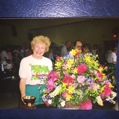 Corry with just one of her award-winning floral arrangements, all from her garden.