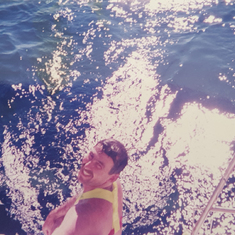Craig having a quick swim off the back while delivering a boat back from Southport in 1996