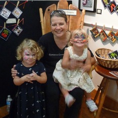 Cynthia with face painted granddaughters