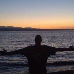 Dakota facing the sunset on the beach, i call this his freedom pose