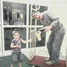 Briana giving Papa a ride on the luggage cart!