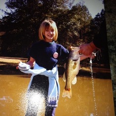 She caught this 3 1/2 lb bass in my pond in back of property
