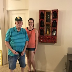 Dan & Kaycee after he hung the cabinet he made for her.