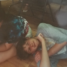 Dan resting on my leg while I play BS in the chorus room Vestal High, last day of school, June 1991
