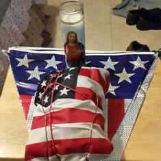 Frank will be dropping this in the waters off of Florida the next time he goes deep sea fishing.  It is an American flag wrapped around a vest Daniel made memorializing his children with his ashes in the pocket.