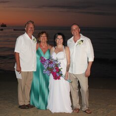 Bill, Darlene, Nicole, and Dave on the beach at the wedding
