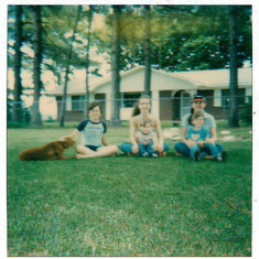Darlene with her kids (and their Irish Setter, Scarlet) in front of their home in Lettsworth, Louisiana on May 30, 1985.