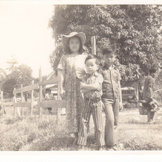 Grandmother in Law's Tuaran Farm - 1977. The 3 children - Caroline, Christopher & Clement