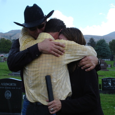 Then there were 3, photo taken at his sister Kim's funeral. Tyler, Kelly and David hugging.