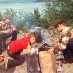 Bruce, Dale and Dave -The boys are having supper out - literally - my guess is this is up around Taku Arm.......not sure. Date between '80 and '82