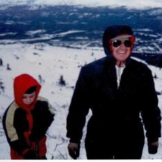 Grandpa Harder on the hill with the Grand kids - ski-dooing and 4 wheeling.