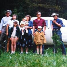 Henry,Gladies,Anita,Bea, Janet,Ben,Glen,Uncle Dave. He said picture was taken at FlatHead River Town site,south of Crowsnest Pass.