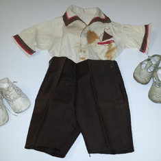 Dave Pfuetze's baby clothes(ca. 1937).  This is the outfit he wears in the photograph of Dave and his father, Scott, taken in 1937.  The baby clothes are part of the Riley County Historical Society's Pfuetze collection at the Riley County Historical Museu