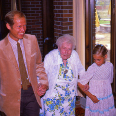 Octavia gets a hand from Dave and Ruthie on her 100th birthday.