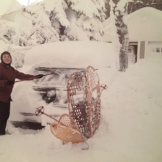 Mary Jane digs out, Feb 1969.  Those are probably the snowshoes that Dad used to wedge against the walls of the well all 3 kids (then he) fell into while tobogganing,  He used them to push us out of the icy water and save all of our lives.