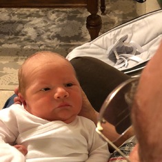 The newest grandson Benjamin is checking out his Grandfather David.