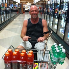 Taking advantage of his knee replacement by using the motorized cart at Ralph's Palm Springs May 2013...he loved it.