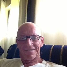 David wearing his favorite reading glasses and sitting in his recliner at home...what a great smile