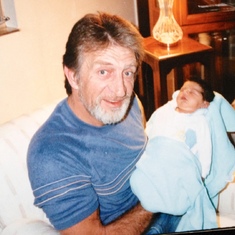 Grandpa with newborn granddaughter Ashley - 1989