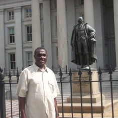 Ayi standing in front of the US department of treasury in Washington DC