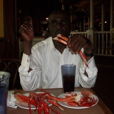 Ayi enjoying some crabs legs in a restaurant downtown DC