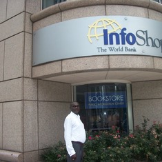Ayi posing in front of the world bank info shop
