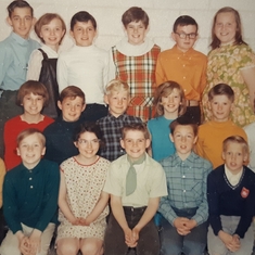 Davey's class photo in Beeton. Top Left of center white turtle neck shirt.