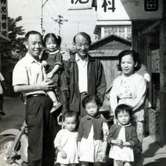 With the saints in front of his clinic in Yonghe; Priscilla, Naomi and Esther