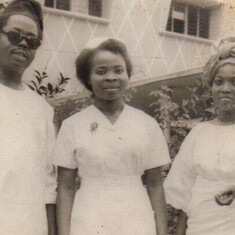 Mum with her best friend turned sister (Mrs. Fadipe), and Daddy.